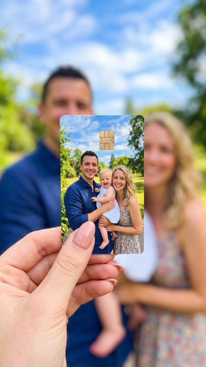 A personalized card sticker held up