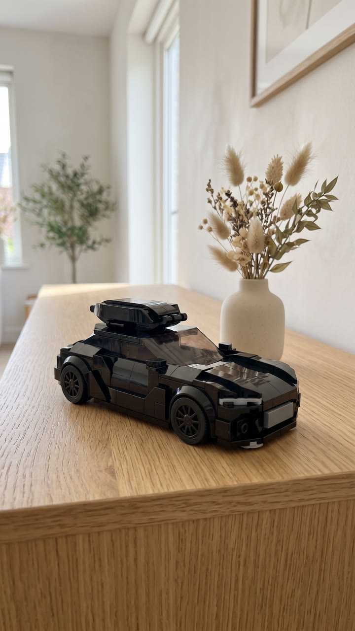 A black brick-built estate with a roof box on a light oak sideboard